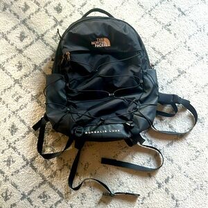 The North Face Borealis Luxe in like new condition! Black with rose gold!